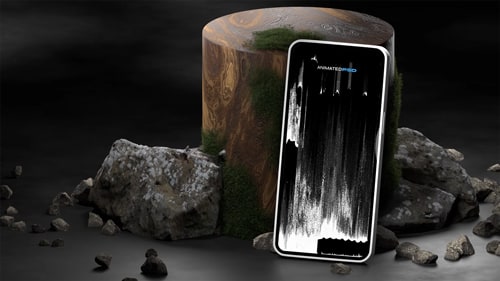 Mobile device leaning against an upright wooden log with rocks all around